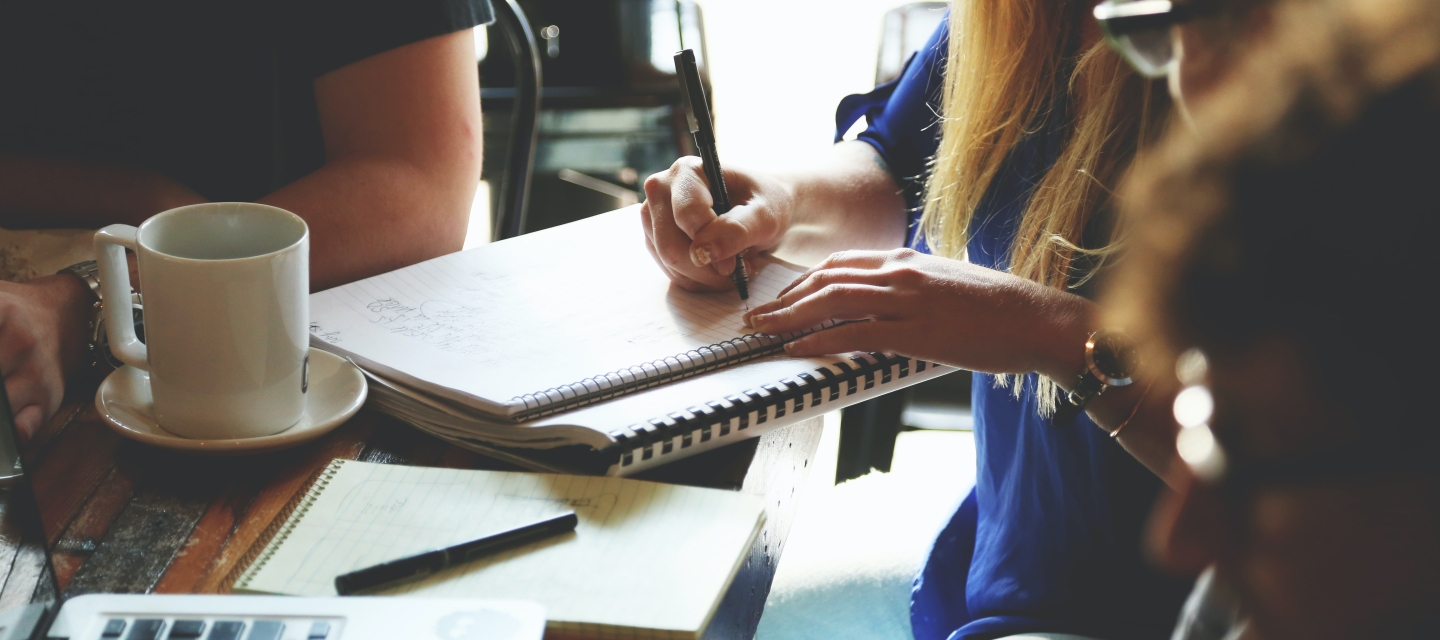 Student writing in notebook