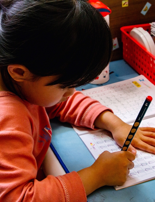 Child with a workbook